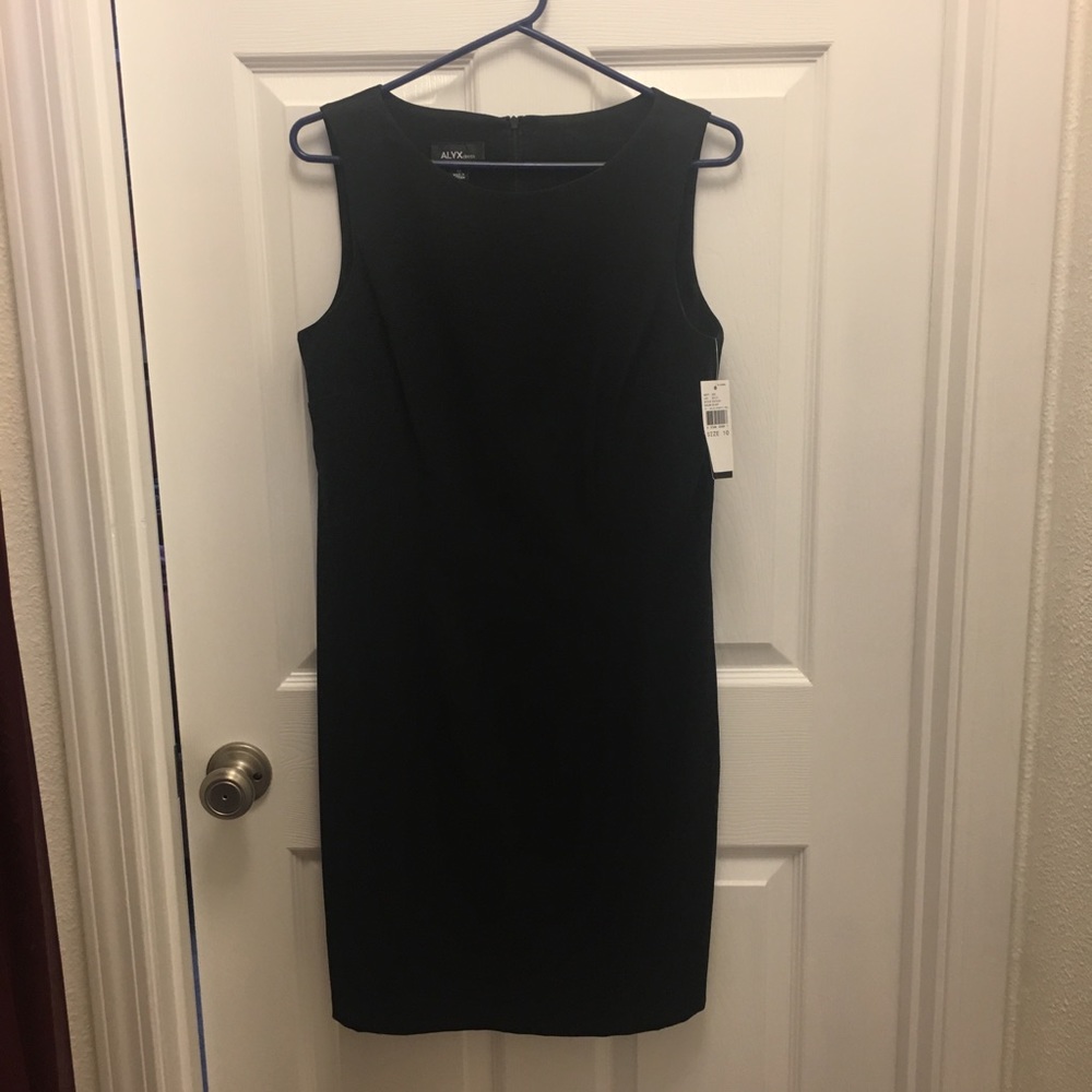 Sleeveless black sheath dress